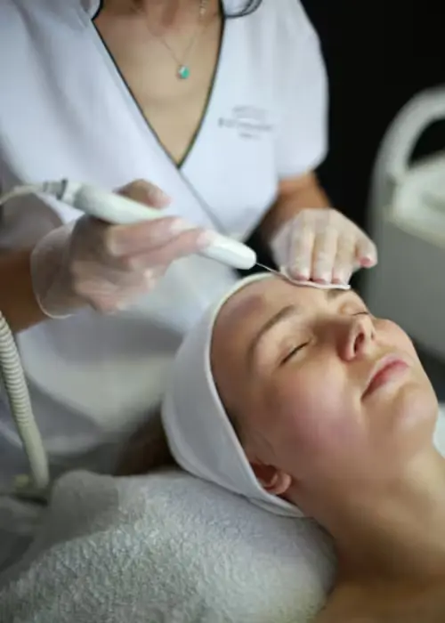 Client receiving AlumierMD BHA 20 Peel facial treatment at Alpha Med Spa Clinic Brampton