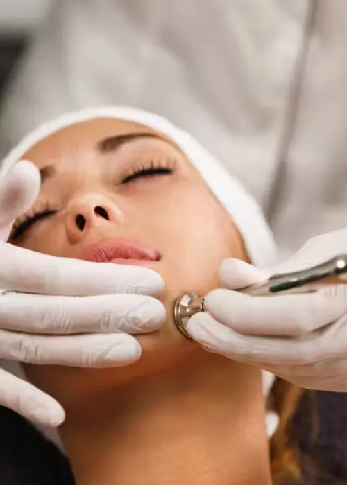 Client receiving AlumierMD BHA 20 Peel facial treatment at Alpha Med Spa Clinic Brampton